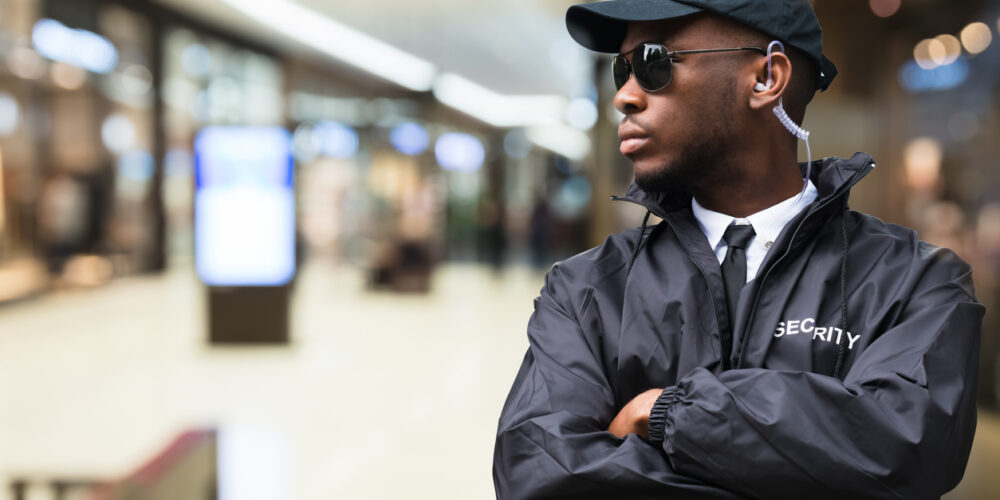 Security Guard In Shopping Mall Security Guard Officer Standing In Shopping Mall
